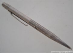 A silver ( Sterling ) Longer lead propelling pencil, mid 20th century marked to top and pocket clip.