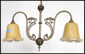 A 20th century brass chandelier - light fitting complete with the 2 shades ( see images online ) in