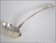 A large 19th century Victorian silver hallmarked ladel bearing hallmarks for Measures 32cm long.
