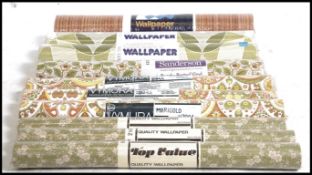 A collection of several rolls of retro vintage mid to late 20th century wallpaper,