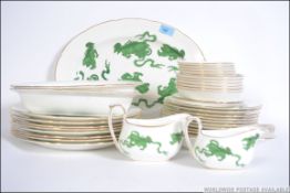 A Wedgwood Chinese Dragons part tea service being stamped to the back to include dinner plates,