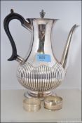 A late 19th century silver plated coffee pot marked for WH & S having ebony handle.