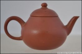 A miniature yi-xing teapot ( tea pot ) dating to the 19th century being finely potted from