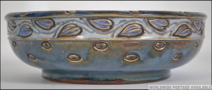 A Royal Doulton stoneware Art Nouveau fruit bowl of drip glaze form,