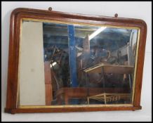 A 19th century large walnut and marquetry tunbridge inlaid overmantel mirror with ceramic bun feet.