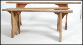 A group of three early 20th century country French pine refectory settles / benches.