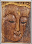 A good large wall hanging carved hardwood plaque of a Balinese bust of a female Asiatic deity