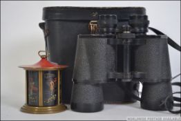 A vintage chintzy wind up travel clock by Europa in the style of a Japanese house with bi sliding