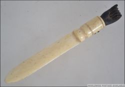 A 19th century Victorian ivory and ebony page turned - paper knife.
