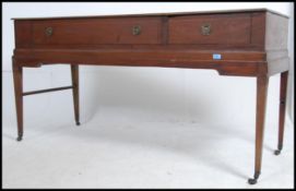 An early 19th century Georgian mahogany inlaid pianoforte piano being converted to a sideboard.
