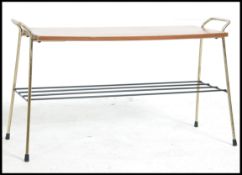 A superb vintage mid 20th century occasional coffee table with surf board style top,