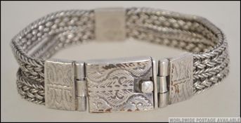 A 19th century Anglo - Indian hand made sterling silver double stranded herringbone wire weave with