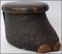 A late 19th century large taxidermy elephants foot stool ( footstool),