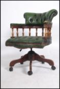 A 20th century green Leather Chesterfield deep button back swivel mahogany framed office chair