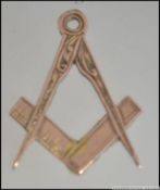 A 9ct gold hallmarked Masonic symbol necklace pendant in the form of a compass and rule.
