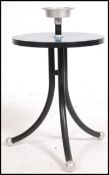 A retro / vintage mid 20th century Resistoid atomic ashtray / occasional table raised on a tripod