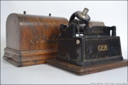 An Edison Gem phonograph complete with serial number being set upon a typical oak baize with domed