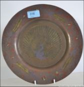 A stunning 19th century Turkish brass plate having enamel overlay Peacock scene to the centre with