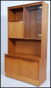 A 1970's Danish influence retro teak wood display cabinet sideboard.