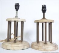A pair of marble early 20th century portico table lamps with copper column supports to upper wooden