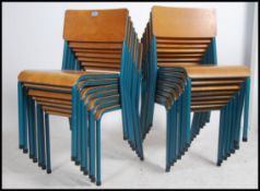 A set of fifteen vintage industrial mid 20th century church / village hall stacking chairs.