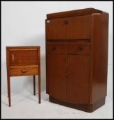 An Art Deco drinks or cocktail cabinet with fitted mirrored interior to top section with a single