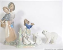 A collection of Lladro & Nao to include 2 Polar Bears by Lladro, Nao girl & boy,