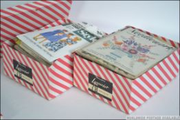 Two boxes of vintage sewing and knitting patterns. Some retaining original templates.
