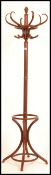 A 20th century bentwood coat stand in the manner of Thonet. Shaped legs to base with hooks atop.