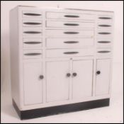 A 1950's mid century dentists cabinet having sectional metal body comprising a series of drawers