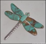 A beautiful David Sandoval Navajo dragonfly brooch adorned with beautiful enamels,