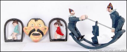 Three cast iron items.