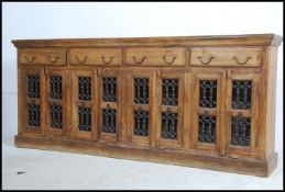 A stunning large arabic sheesham and brass sideboard dresser.