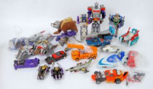 TRANSFORMERS: A large quantity of vintage 1980's G1 Transformers toys by Hasbro,