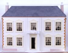 'THE MANOR' DOLLS HOUSE: A beautiful 20th century Manor House wooden dolls house.