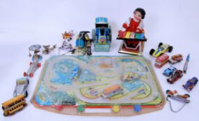 TINPLATE: A collection of assorted vintage loose tinplate clockwork and other related metal toys.