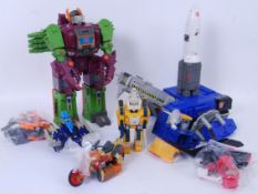 TRANSFORMERS: A collection of vintage 1980's G1 Transformers toys by Hasbro, to include: Greasepit,