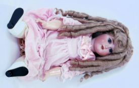 ANTIQUE DOLL: A good late 19th / early 20th century German made bisque headed antique doll.