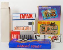 TINPLATE: A collection of 8x vintage Russian / Japanese made tinplate clockwork vehicles and track