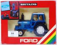 BRITAINS: An original vintage Britains diecast model 9523 Ford Tractor. Mint model, in original box.