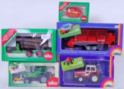 SIKU: A collection of 5x boxed Siku diecast model farm related models - all within the original