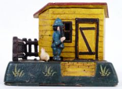 MONEY BOX: A vintage Victorian style 20th century cast iron hand painted automaton style money box