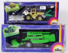 SIKU: Two Siku diecast model farm vehicles - 3151 and 3850. Both mint, in original boxes.