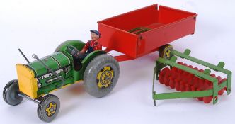 METTOY: A charming vintage Mettoy tinplate clockwork tractor, trailer and plough. Working order.