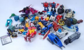 TRANSFORMERS: A large quantity of assorted vintage G1 Hasbro Transformers action figures.