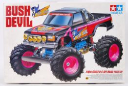 TAMIYA: An original vintage Tamiya ' Bush Devil ' radio controlled truck. With original box.
