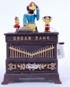 MONEY BOX: A vintage Victorian style 20th century cast iron hand painted automaton style money box