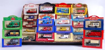 LLEDO: A collection of 32x Lledo promotional diecast models - Rowntrees, Coca Cola, Rupert The Bear.