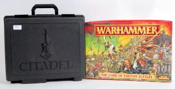 WARHAMMER: A plastic case of Warhammer painted war gaming figures containing 3x trays of various