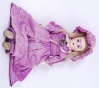 ANTIQUE DOLL: An unusual likely German made antique doll with bisque head and leather body.